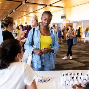 Woman standing at an information table